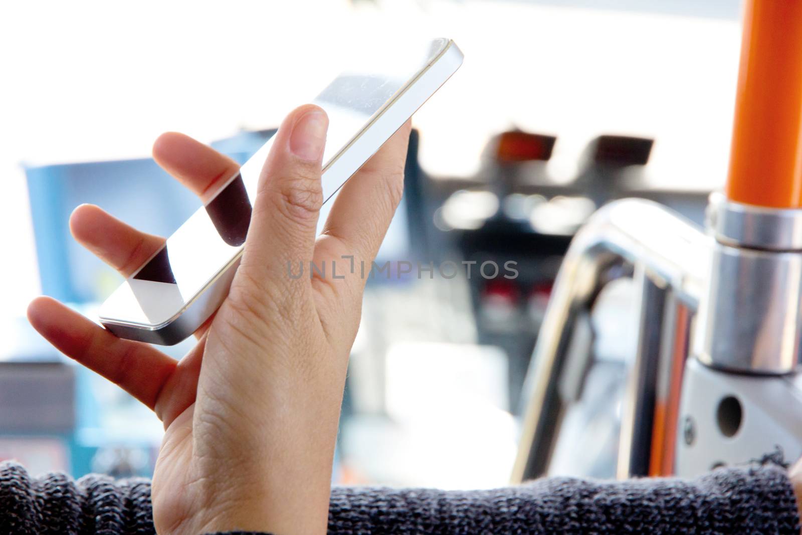 Woman Using a Smart Phone on the bus