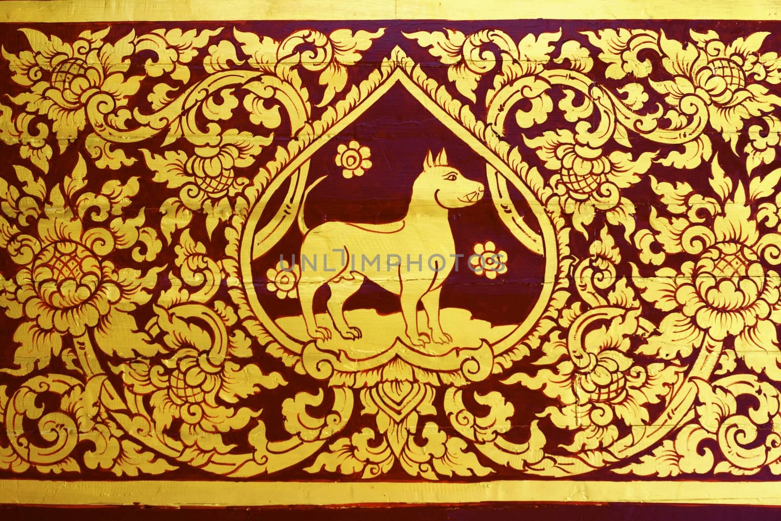 detail of thai pattern that made by covered wood plate with gold leaf for decorated temple door or pillar,shallow focus
