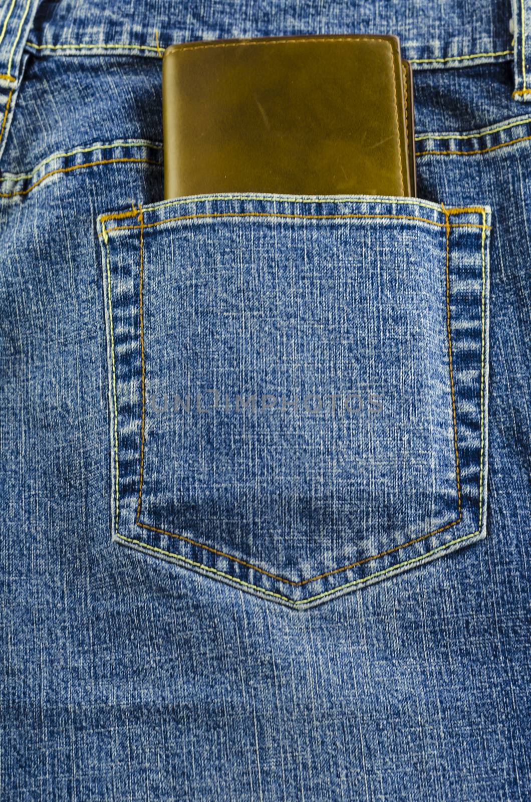 blue jeans pocket with brown wallet