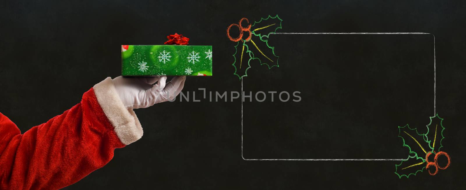 Santa Claus Father Christmas hand with wrapping paper present and list notes