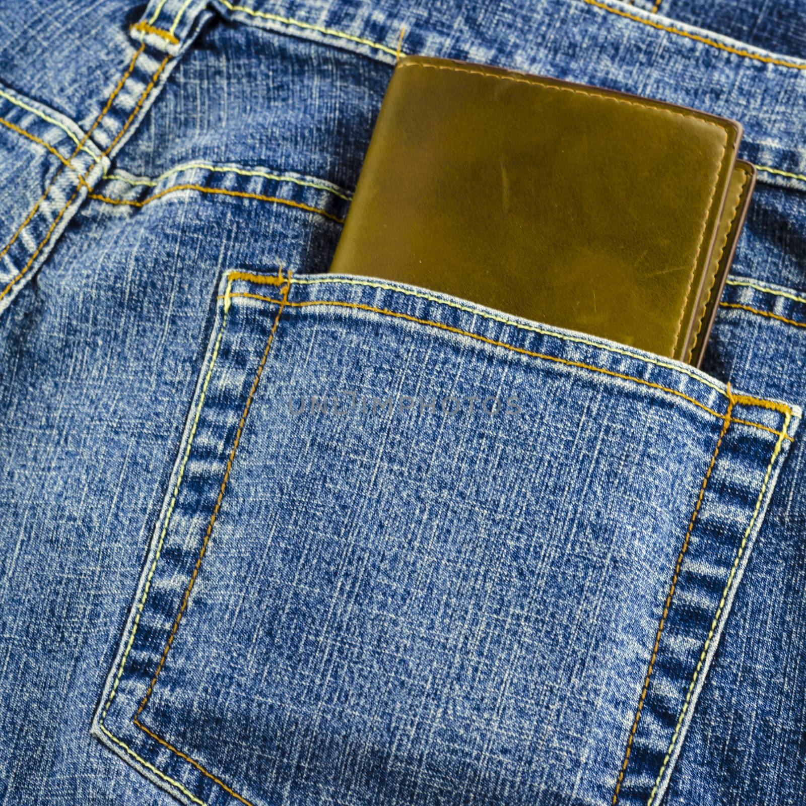 blue jeans pocket with brown wallet