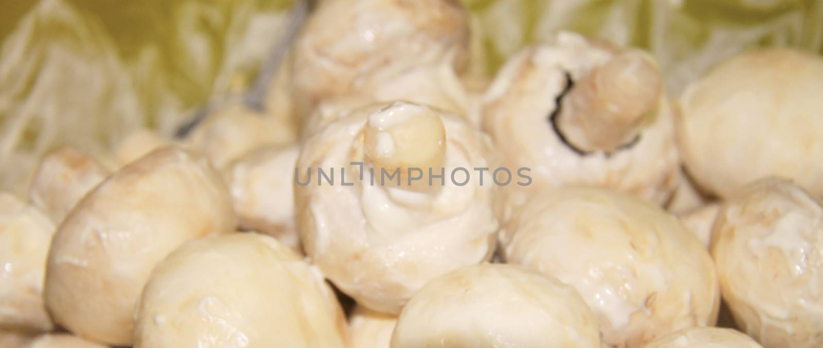 Champignon mushrooms in marinade ready for cooking