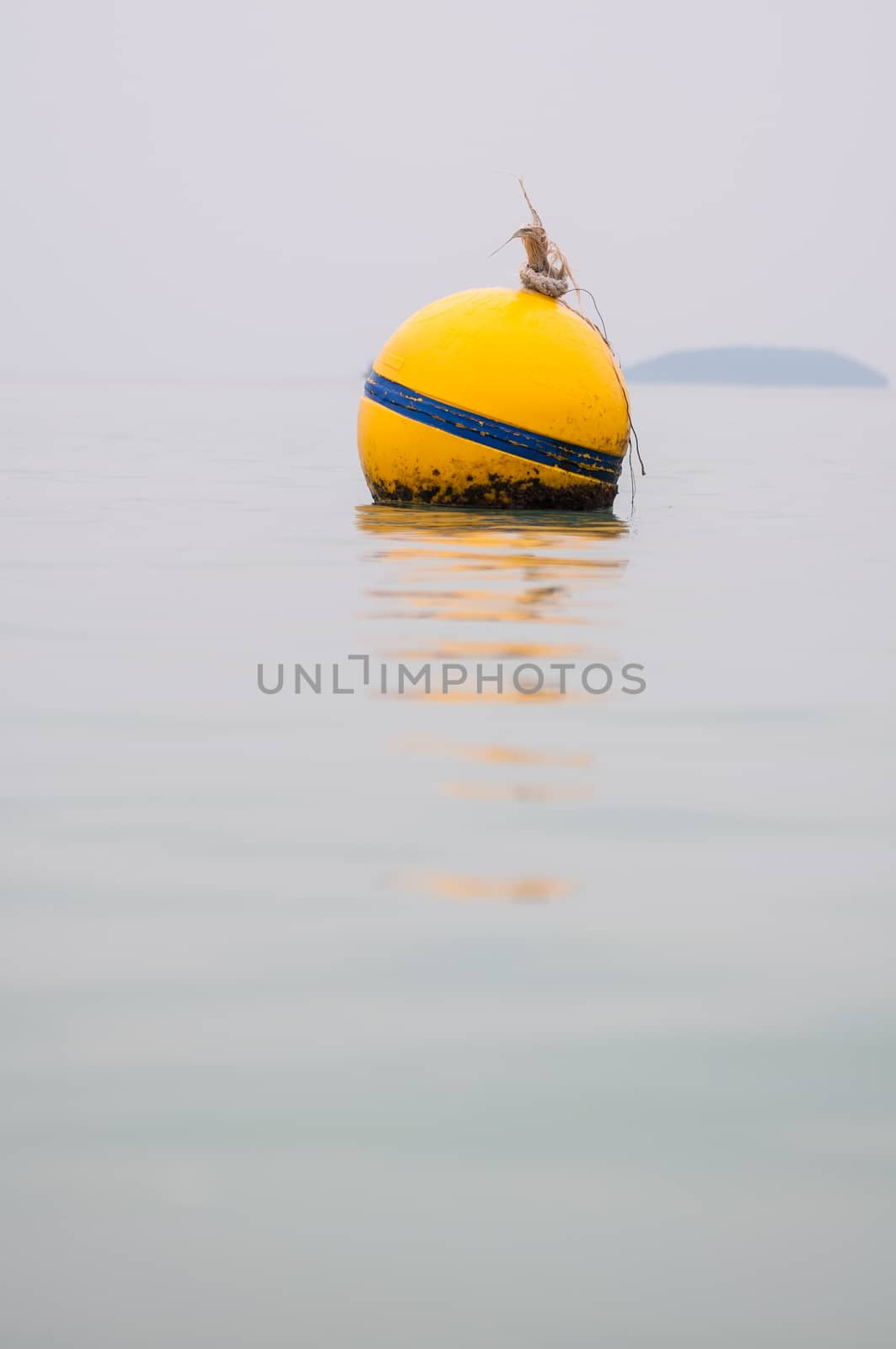 Yellow Buoy floats in the sea of Thailand