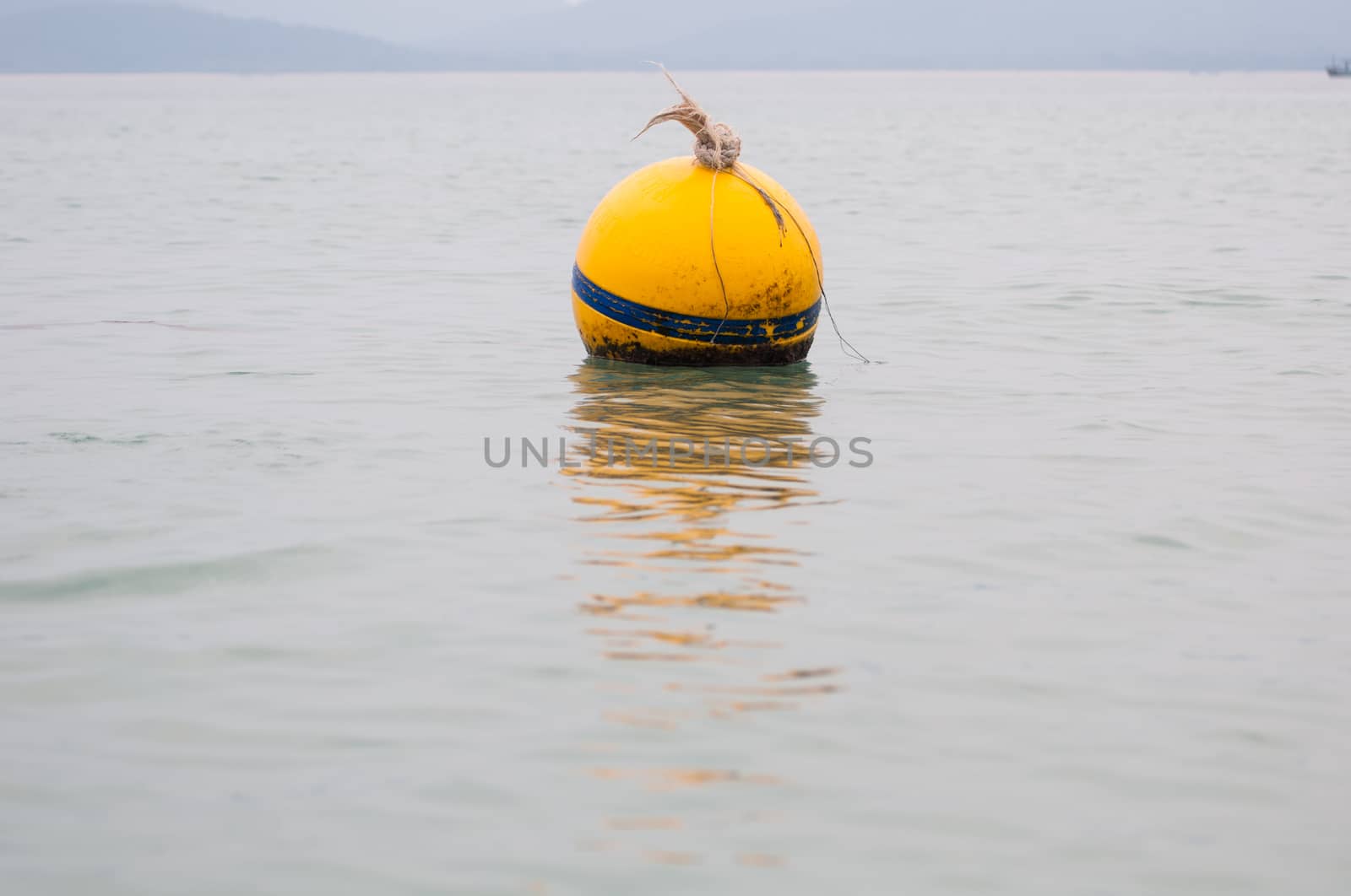 Yellow Buoy floats in the sea of Thailand