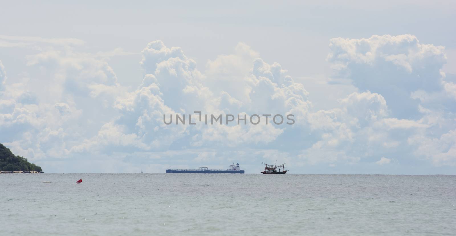 Ship Transport Goods in the sea with sky background