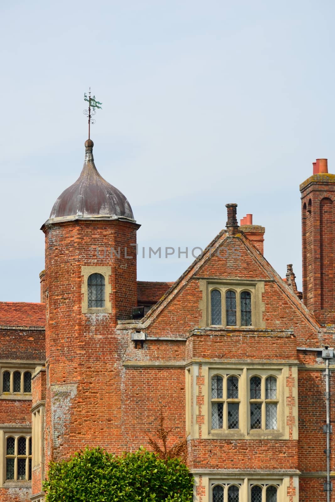 Tudor Brick Building with tower by pauws99