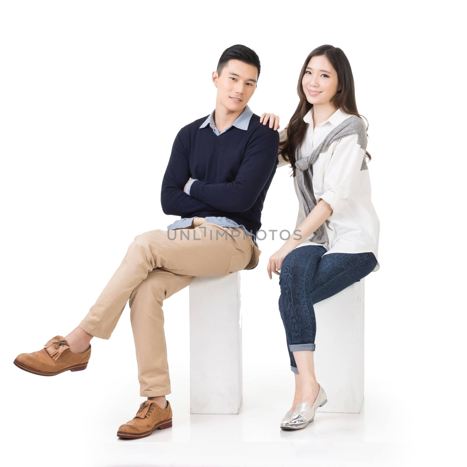 Portrait of young Asian couple sit by elwynn