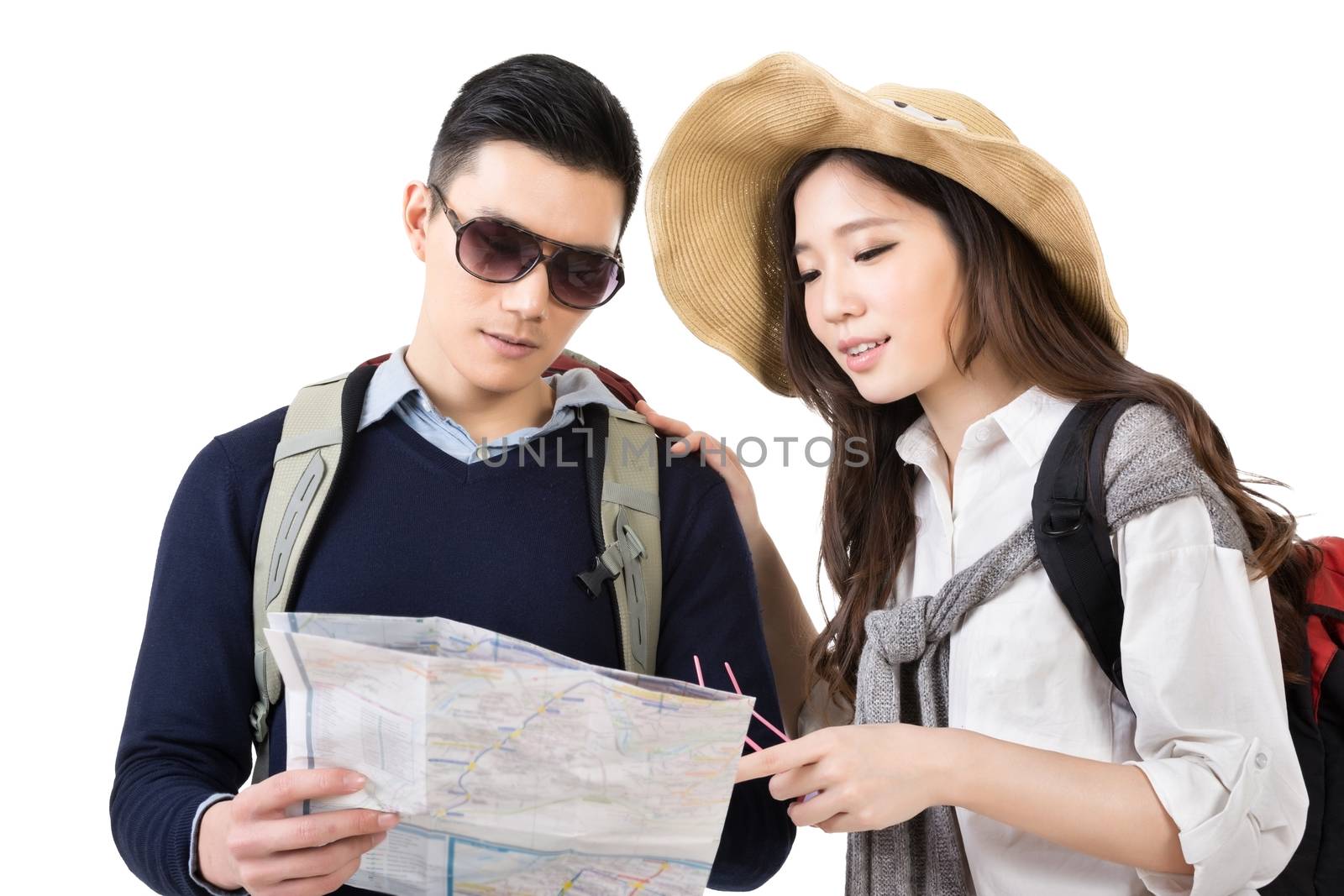 Young Asian couple travelers looking the map, closeup portrait on white background.