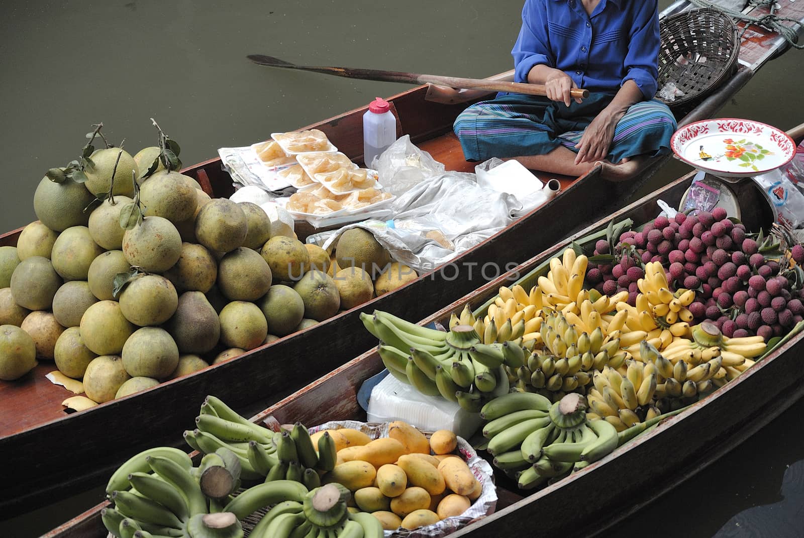 fruits in traditional floating market , Thailand. by think4photop