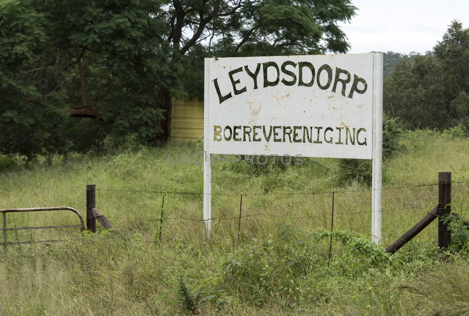 old abandon gold mine village leydsdorp in south arica with parking and restaurant sign