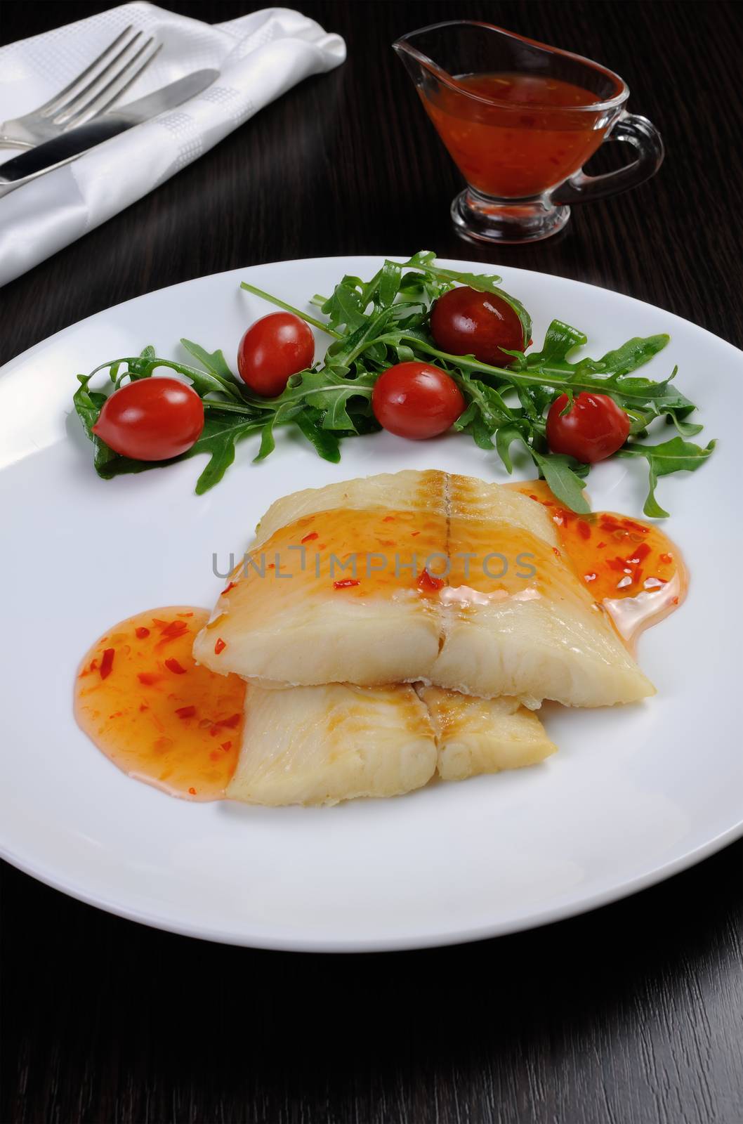 Flounder fillets in sauce with arugula and cherry tomatoes by Apolonia