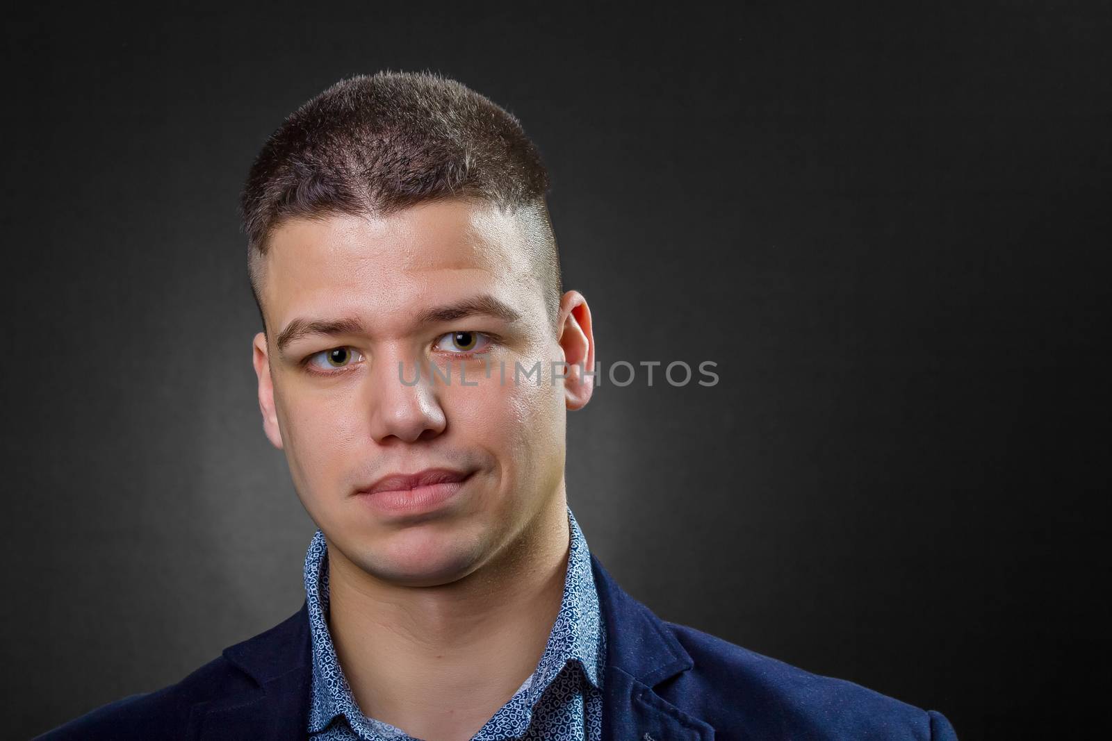 Confident business man wearing blue shirt and jacket