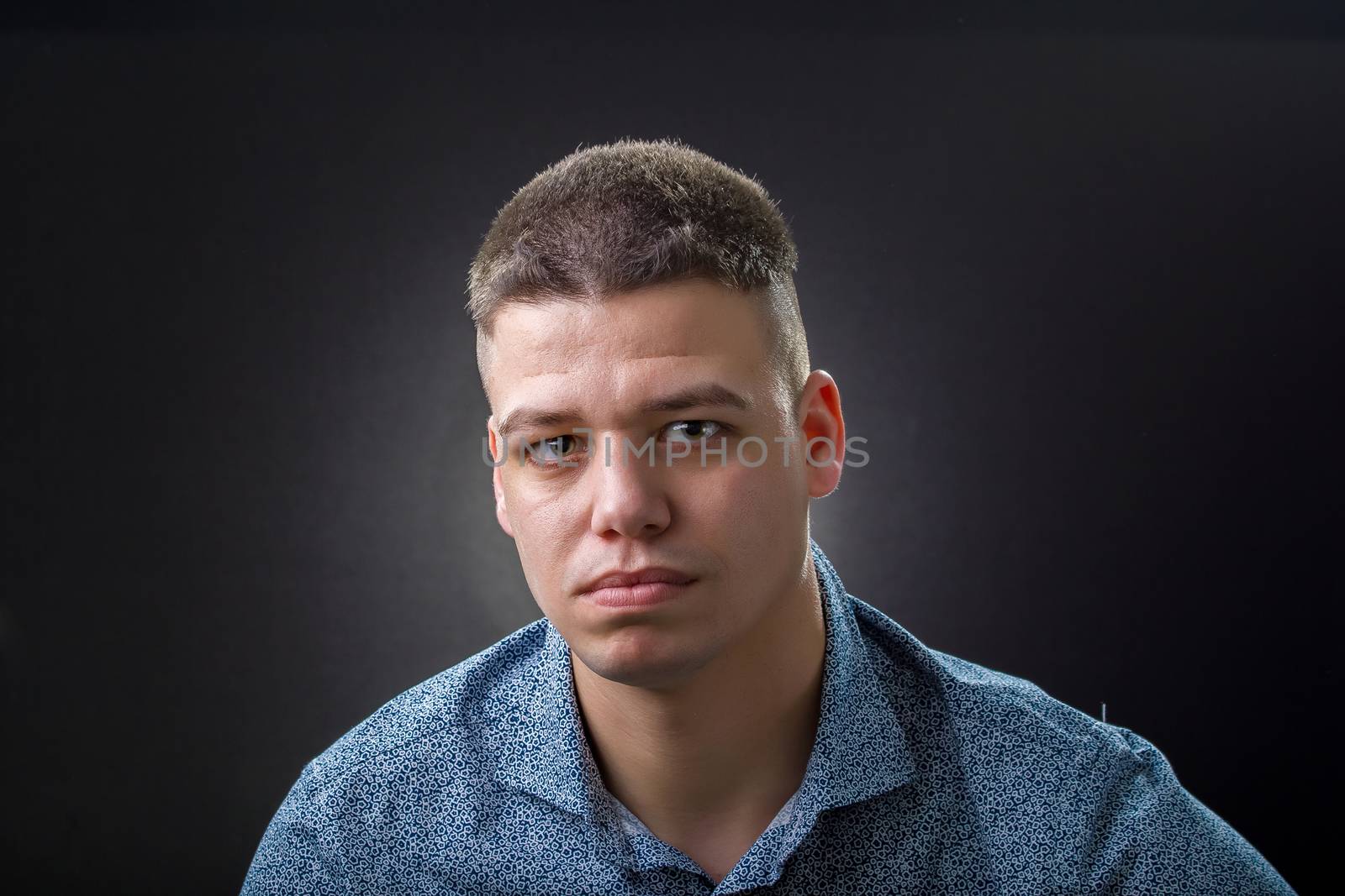 Serious business man wearing blue shirt