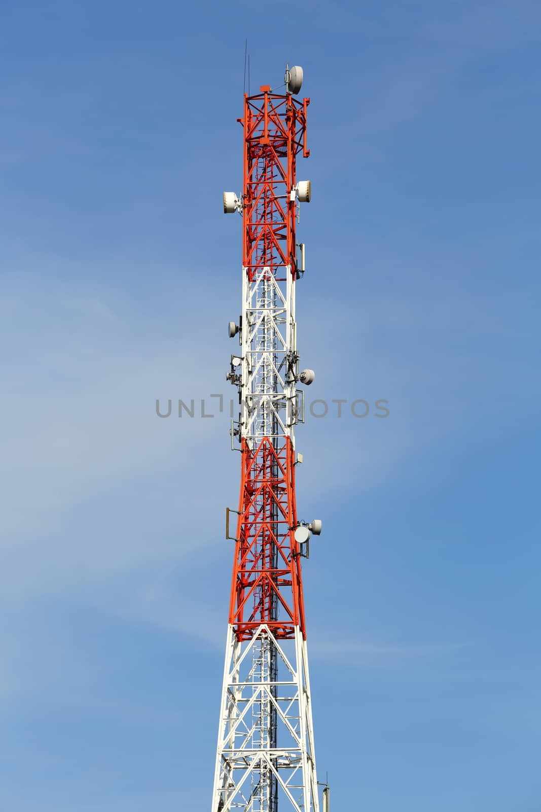 Communication transmitter tower against clear blue sky