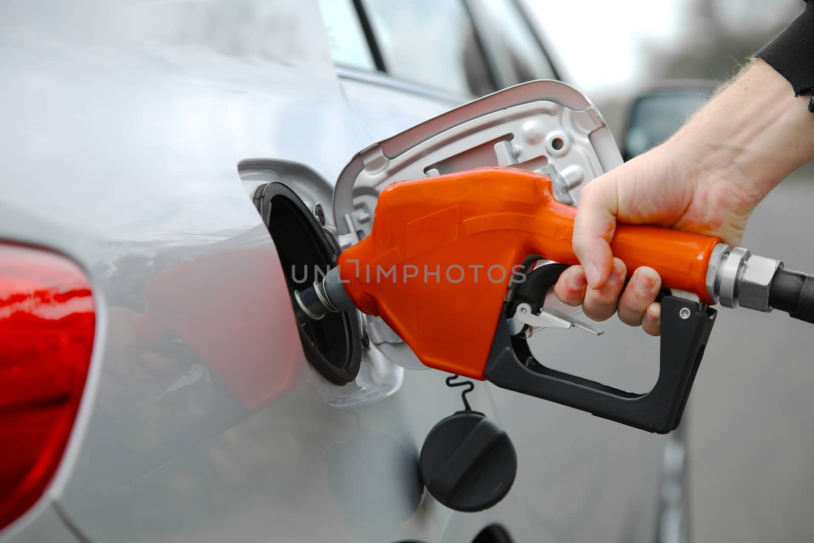 Fuel nozzle with hose isolated on white background