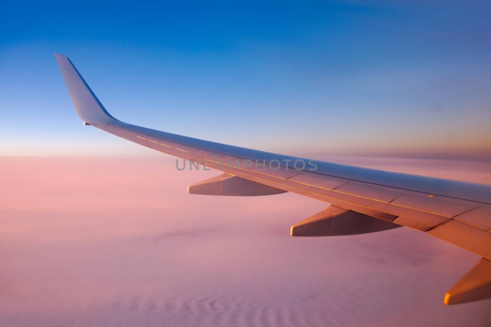 Sunrise view from an aircraft - Never forget to book a seat by the window