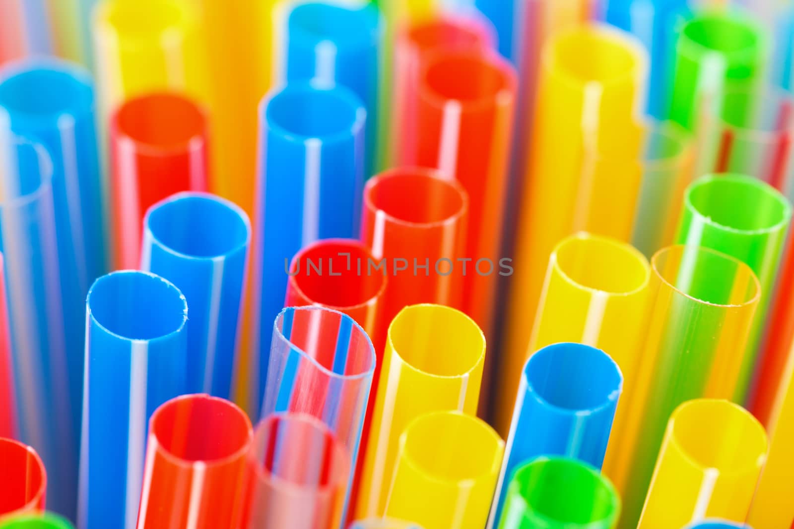 Colored Plastic Drinking Straws closeup by Discovod