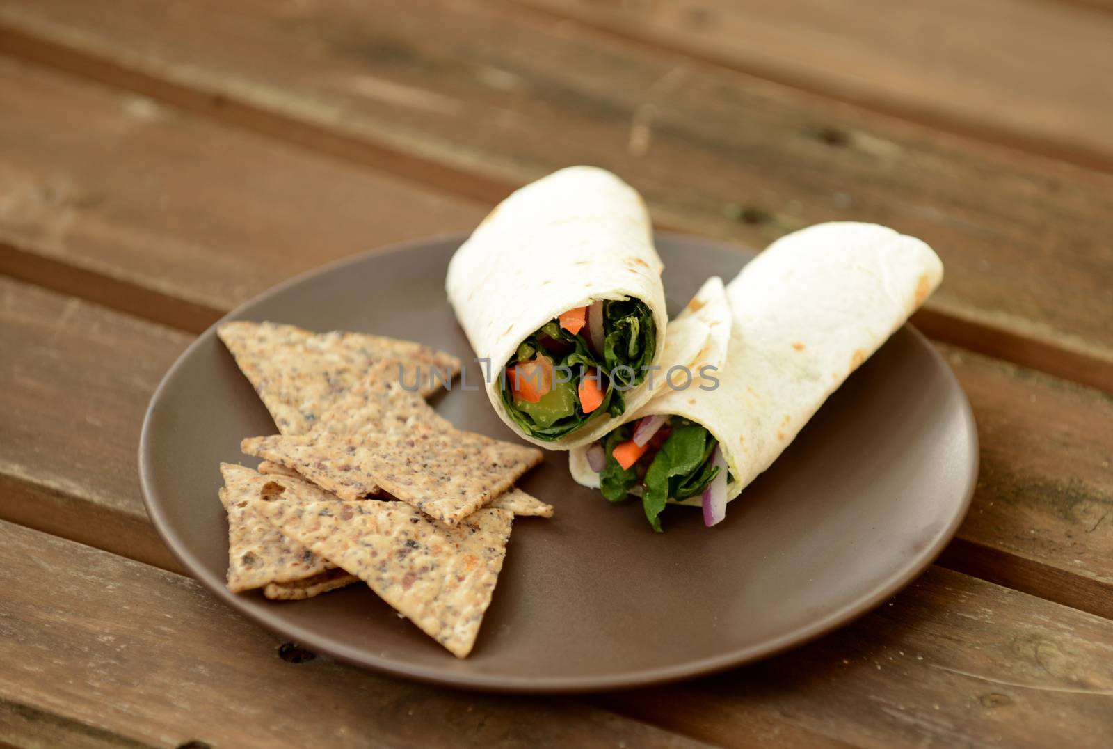 vegetable wrap with tortilla chips on a plate