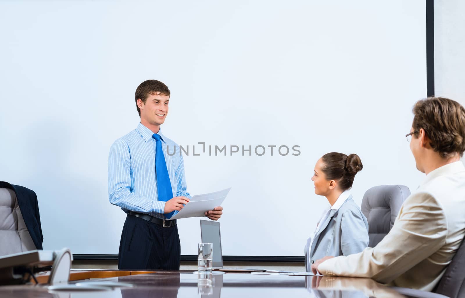 image of a businessman talking to colleagues, teamwork in the office