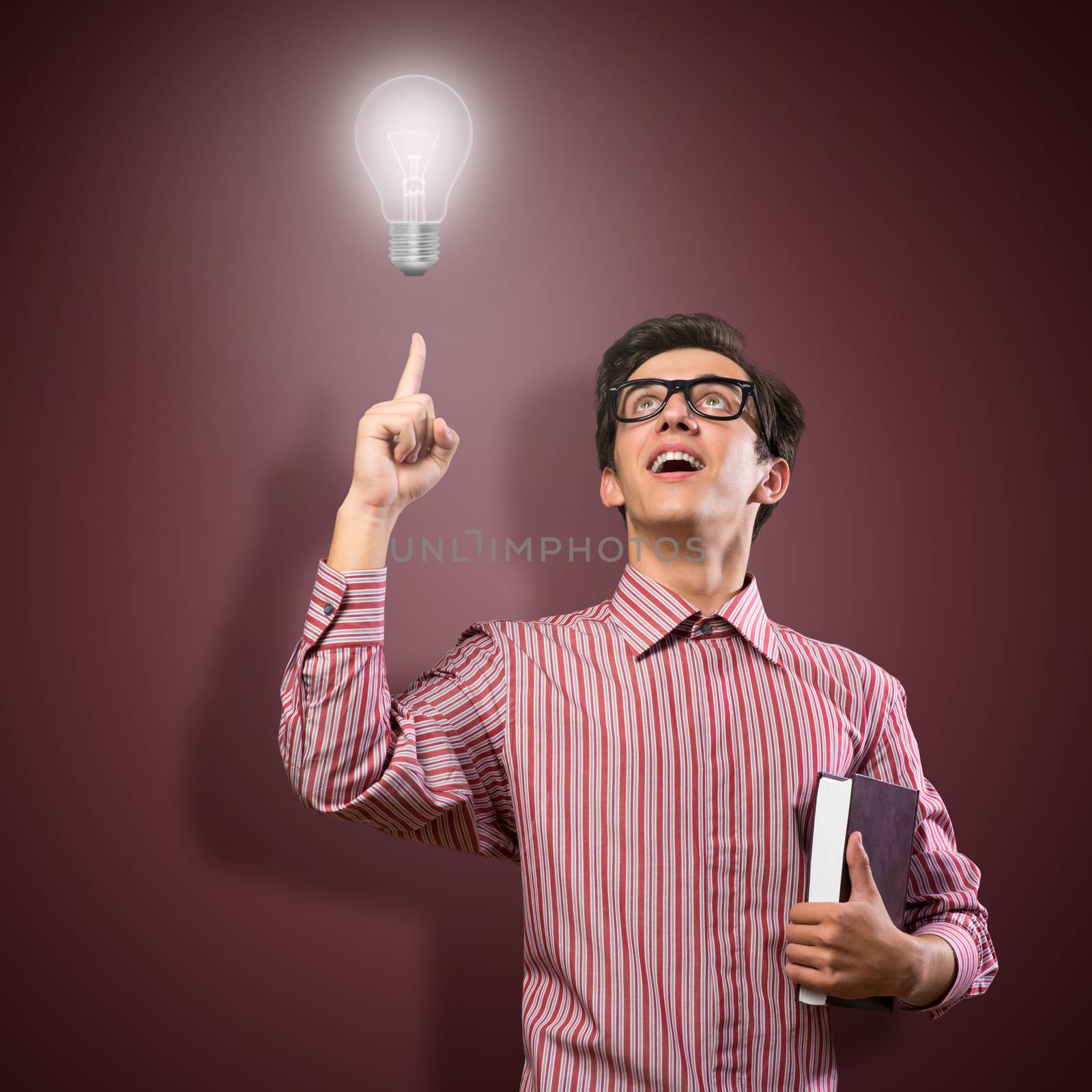 young man holding a book by adam121