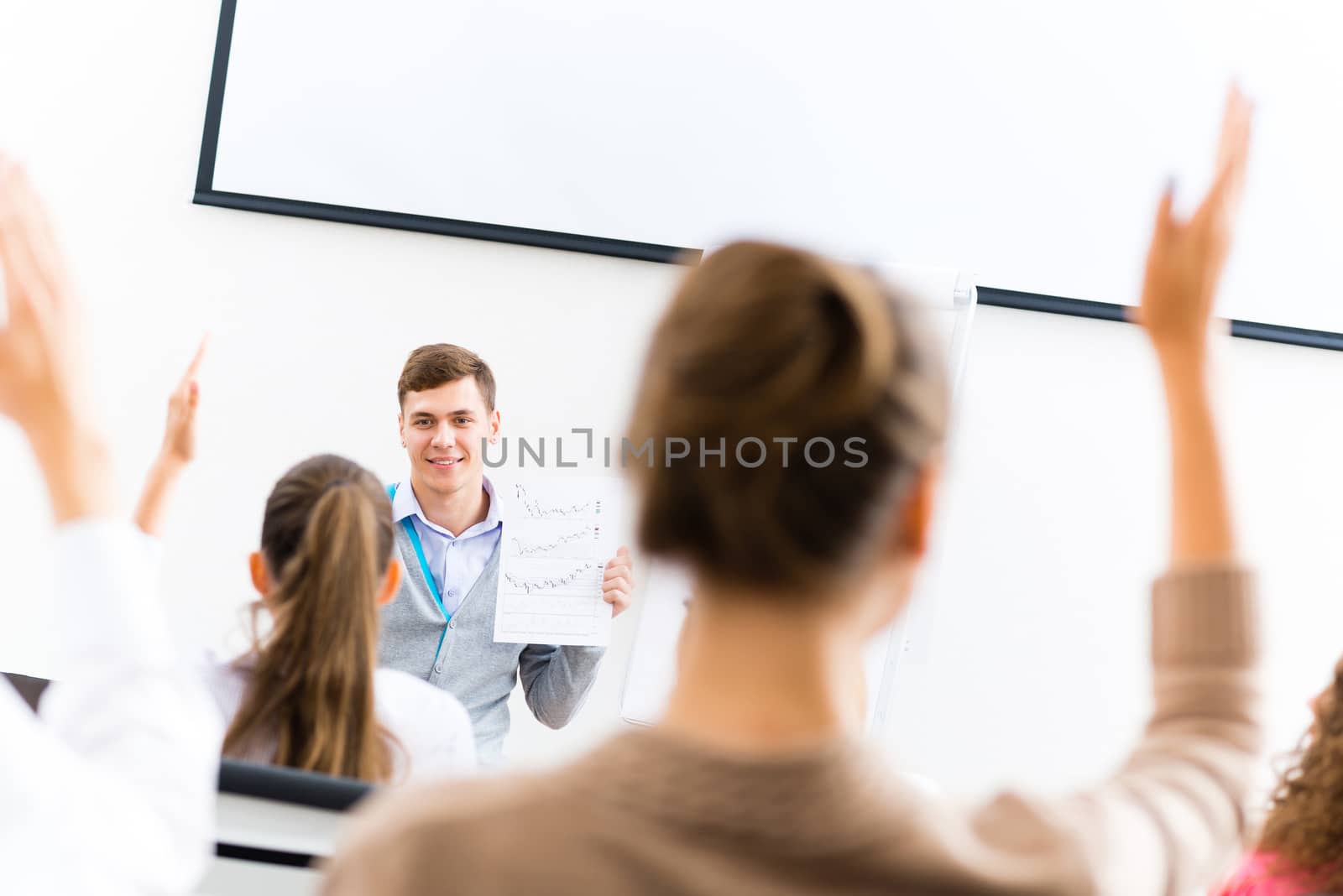 teacher talking with students by adam121