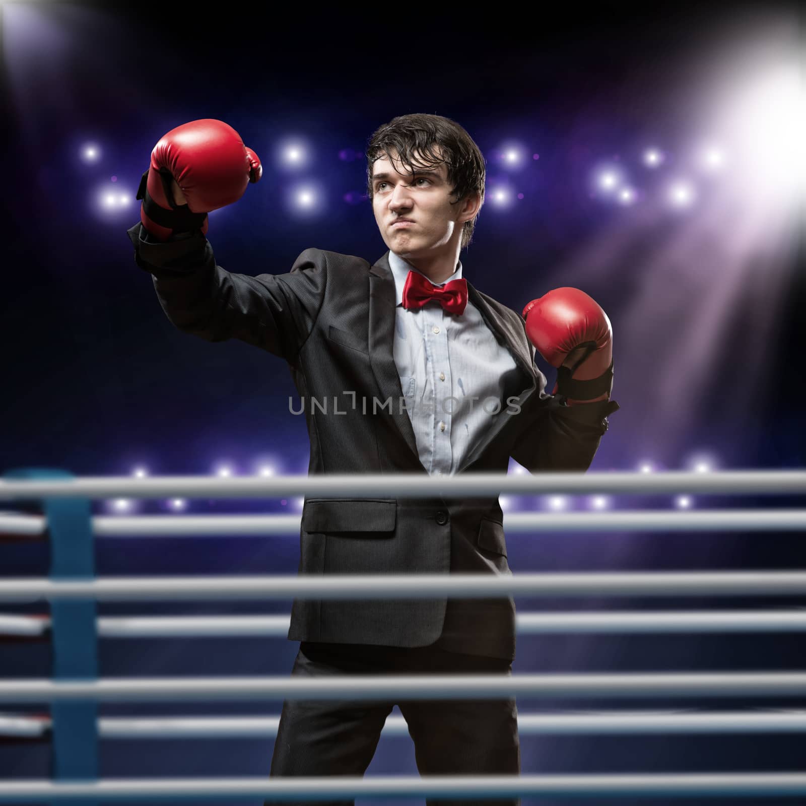 businessman with boxing gloves in the ring by adam121