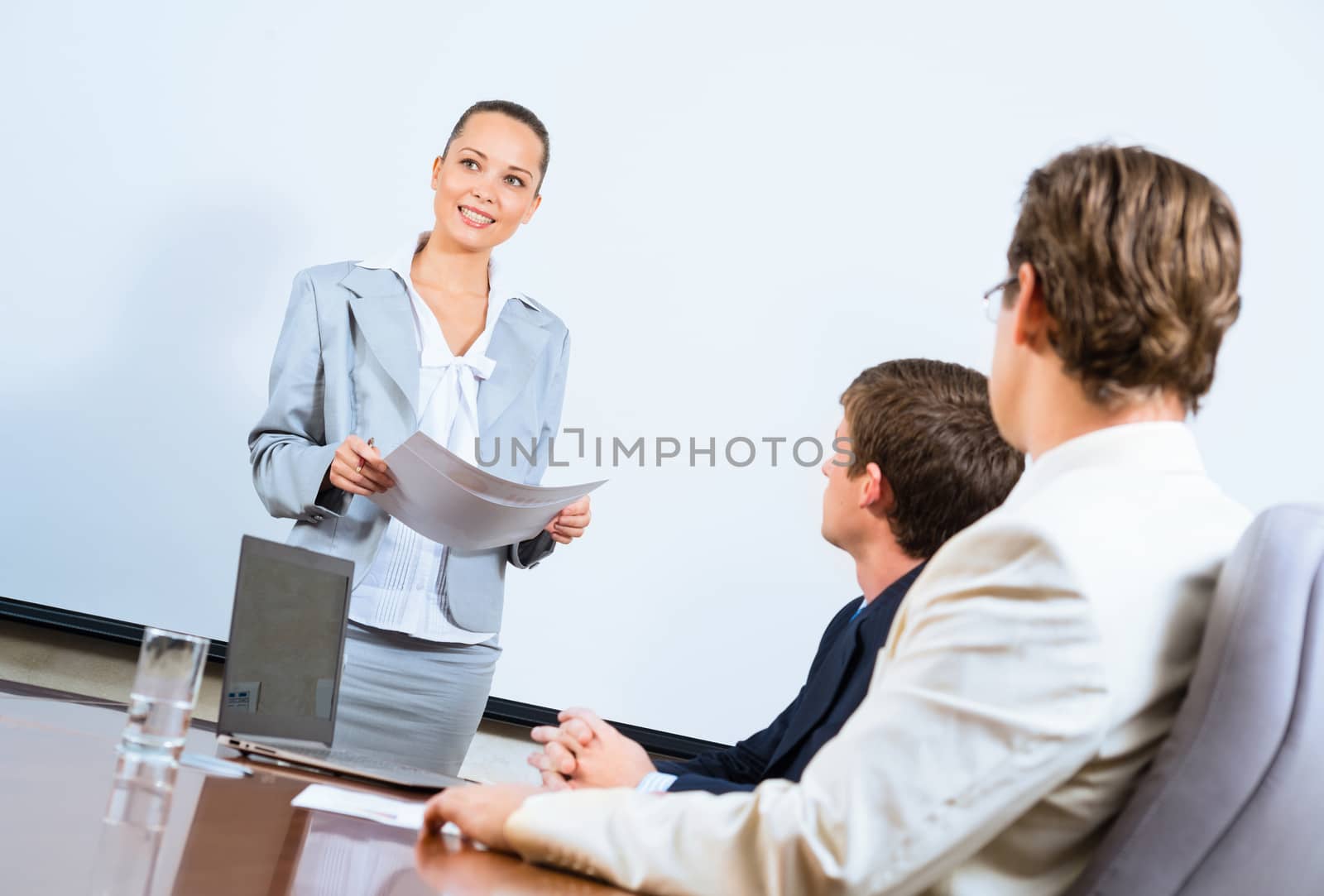 image of a discusses business woman with colleagues