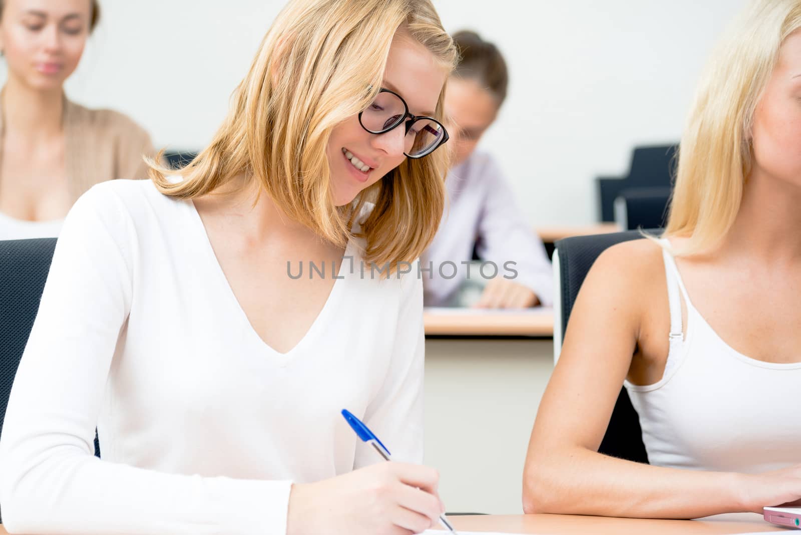 portrait of young female student in the classroom, teaching at the University of