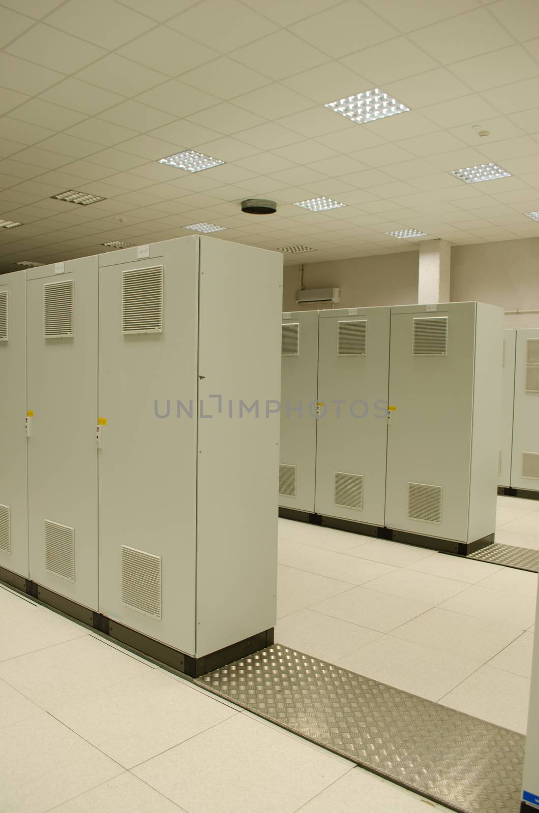 Powerful servers computers placed in special cabinets stored in scientific research center.