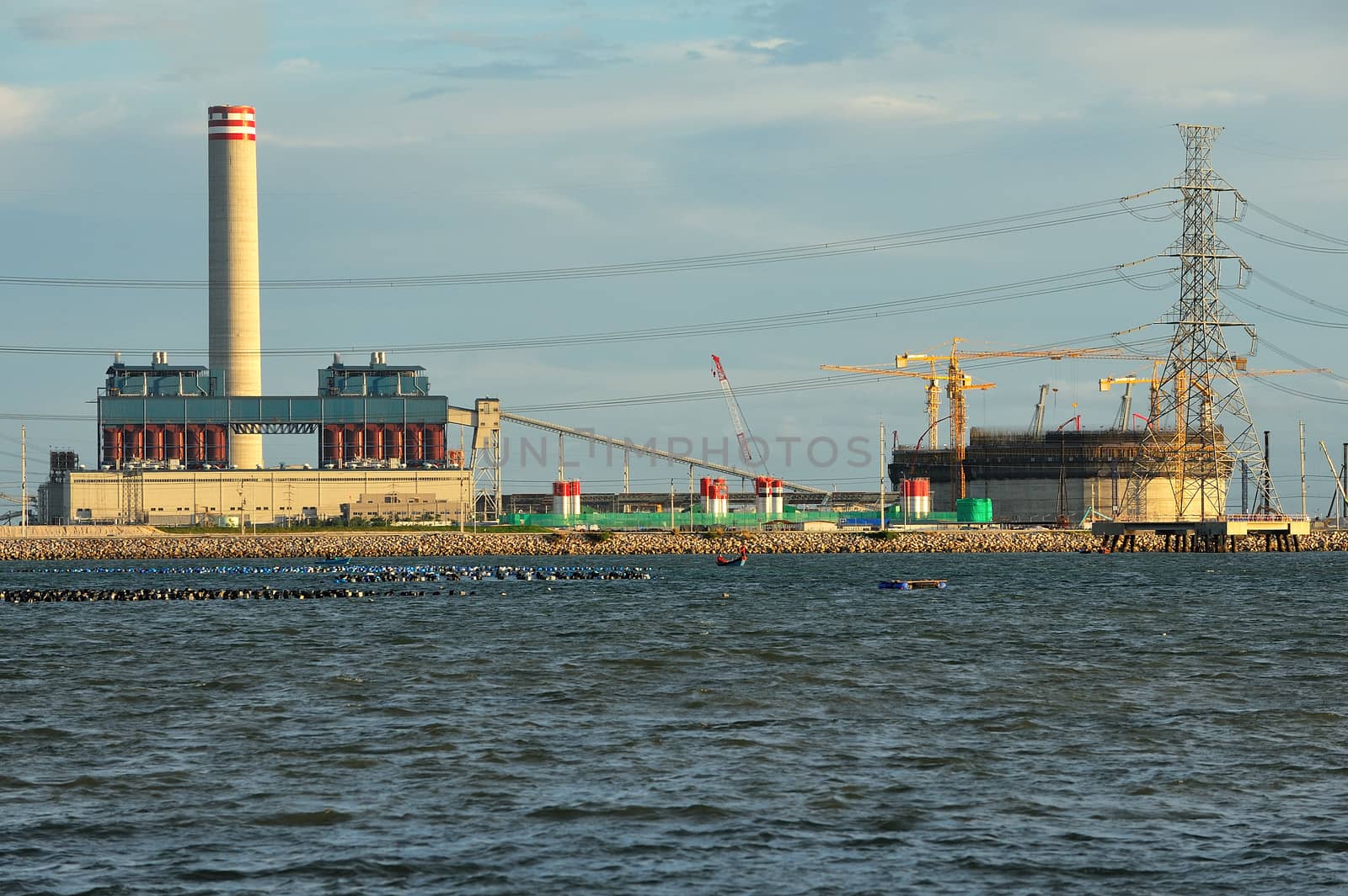 industrial power plant in the sea. by think4photop