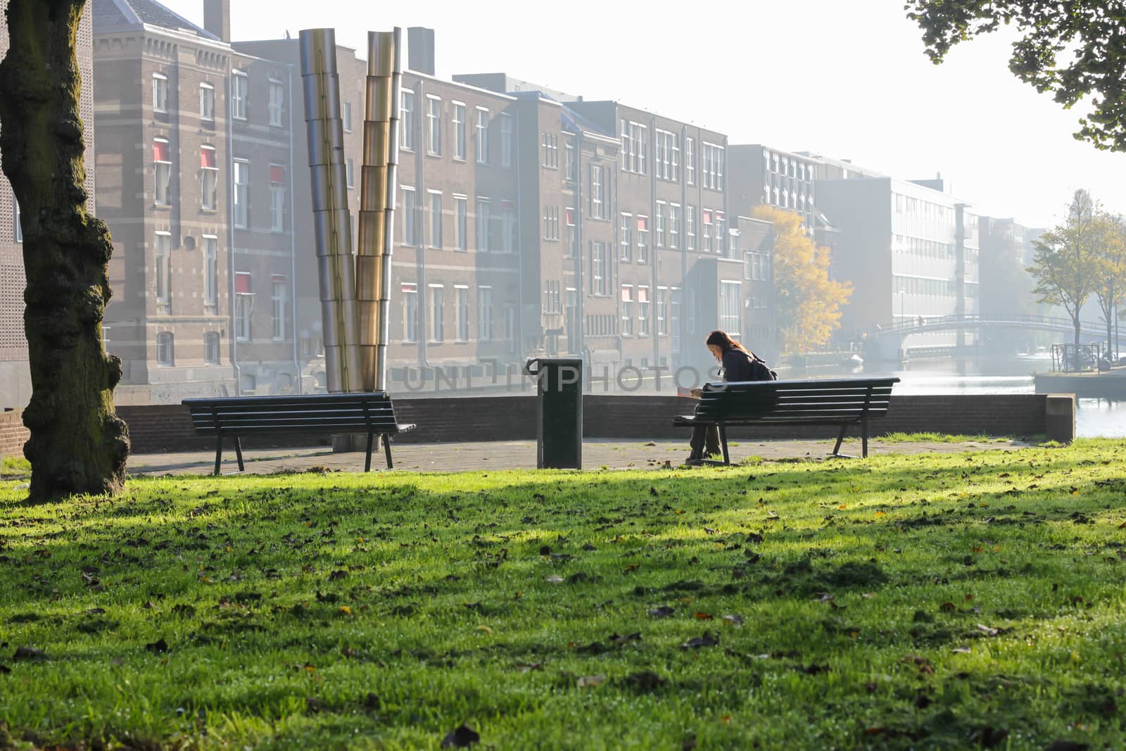 Tourist in the Amsterdam park, early morning