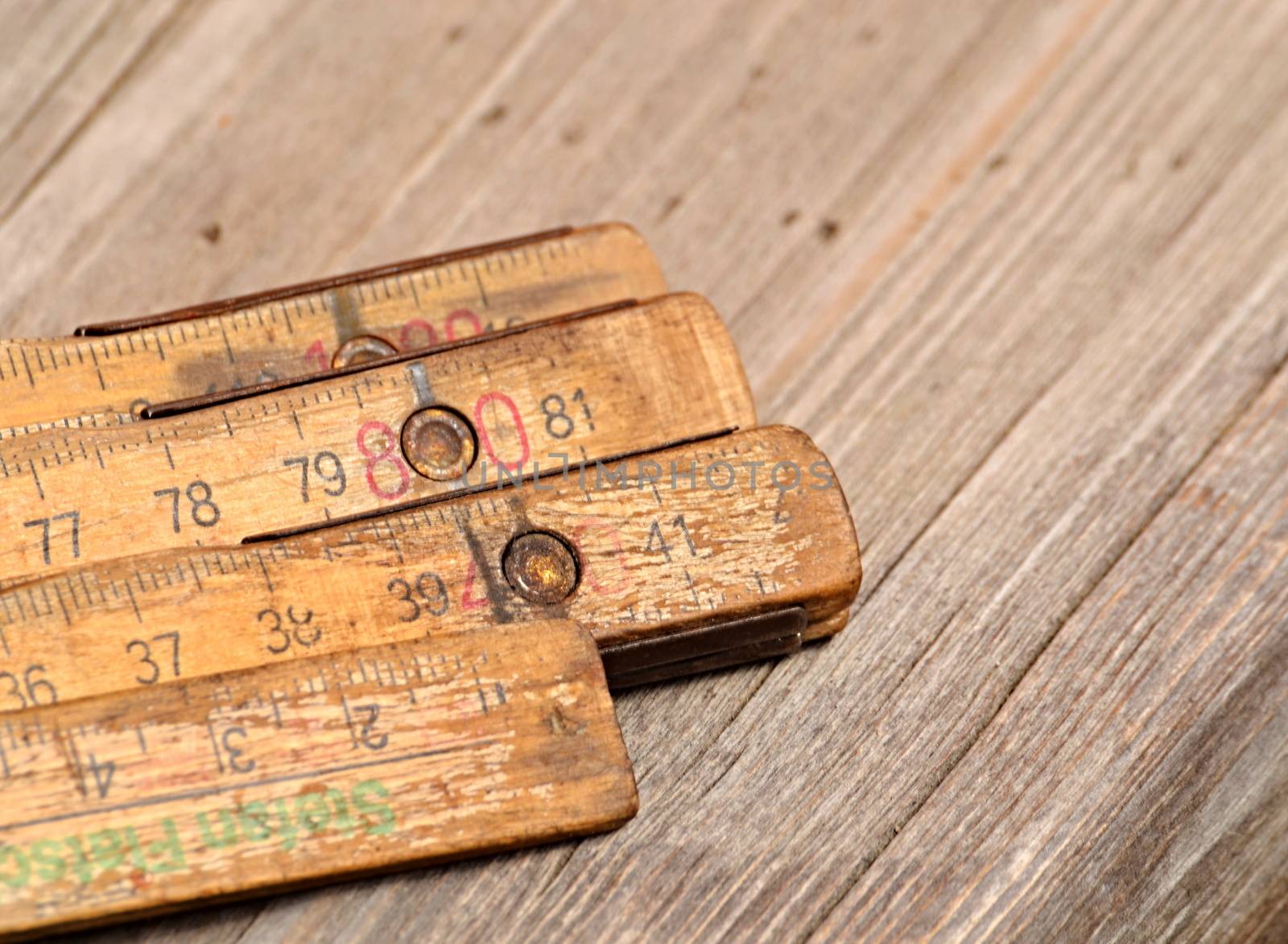 background old wood folding rule on the table