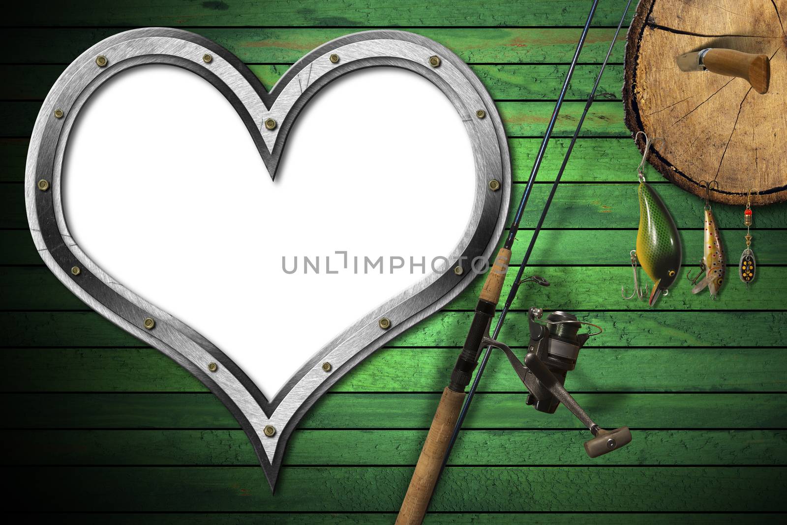 Empty metal porthole heart shape on green wooden wall with fishing tackle, fishing rod and pen knife