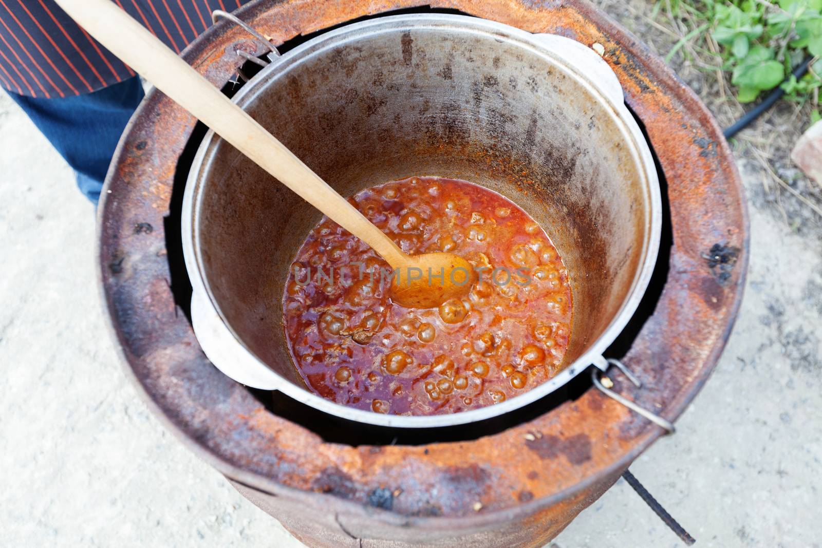 Prepare of hungarian soup goulash in the boiler. Closeup