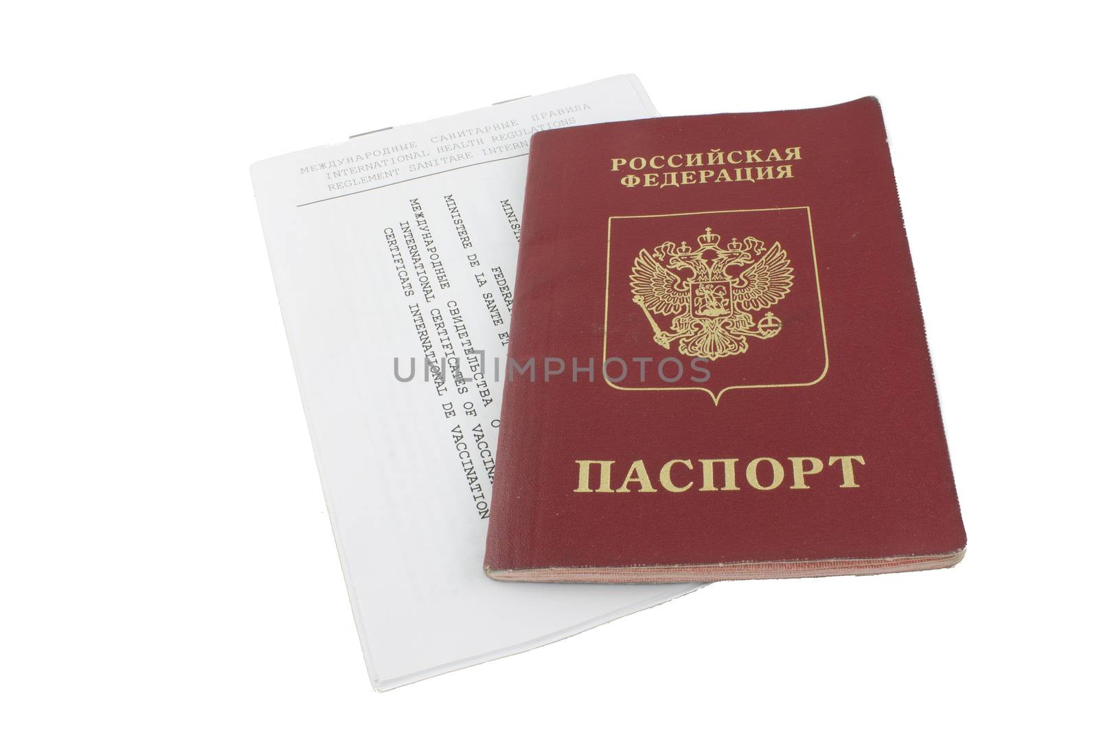 passport and an international certificate of vaccination on white background