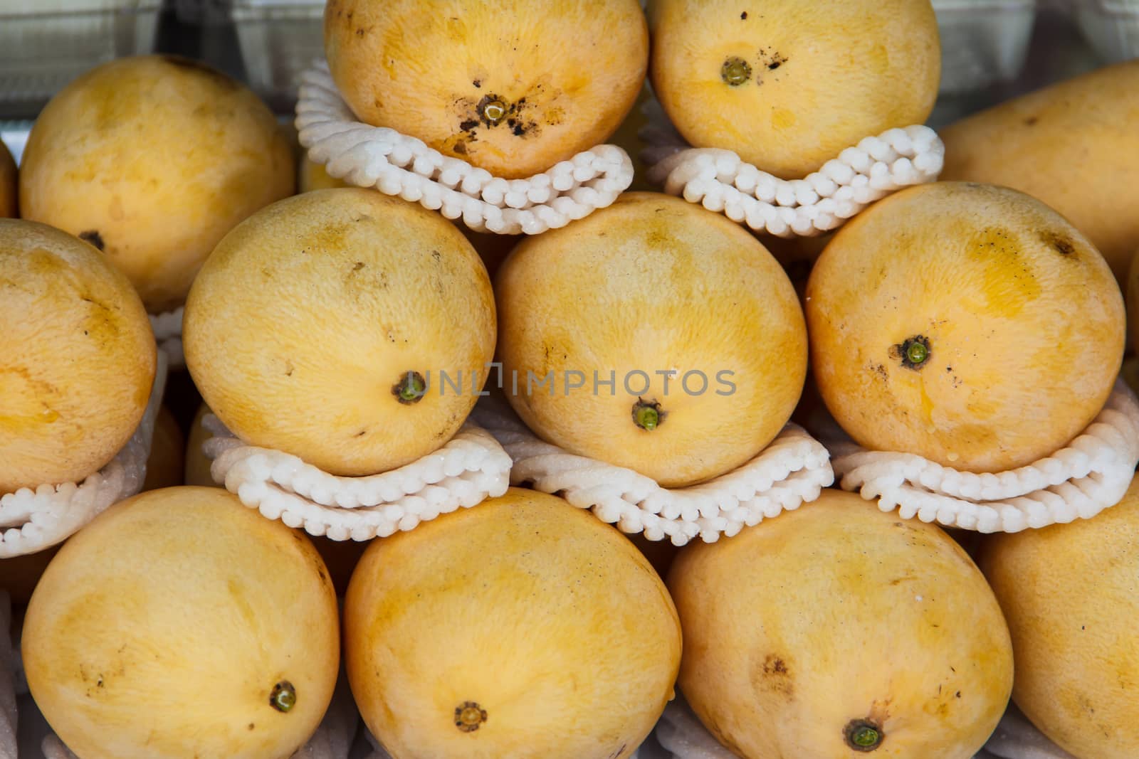 Ripe yellow mango in the market