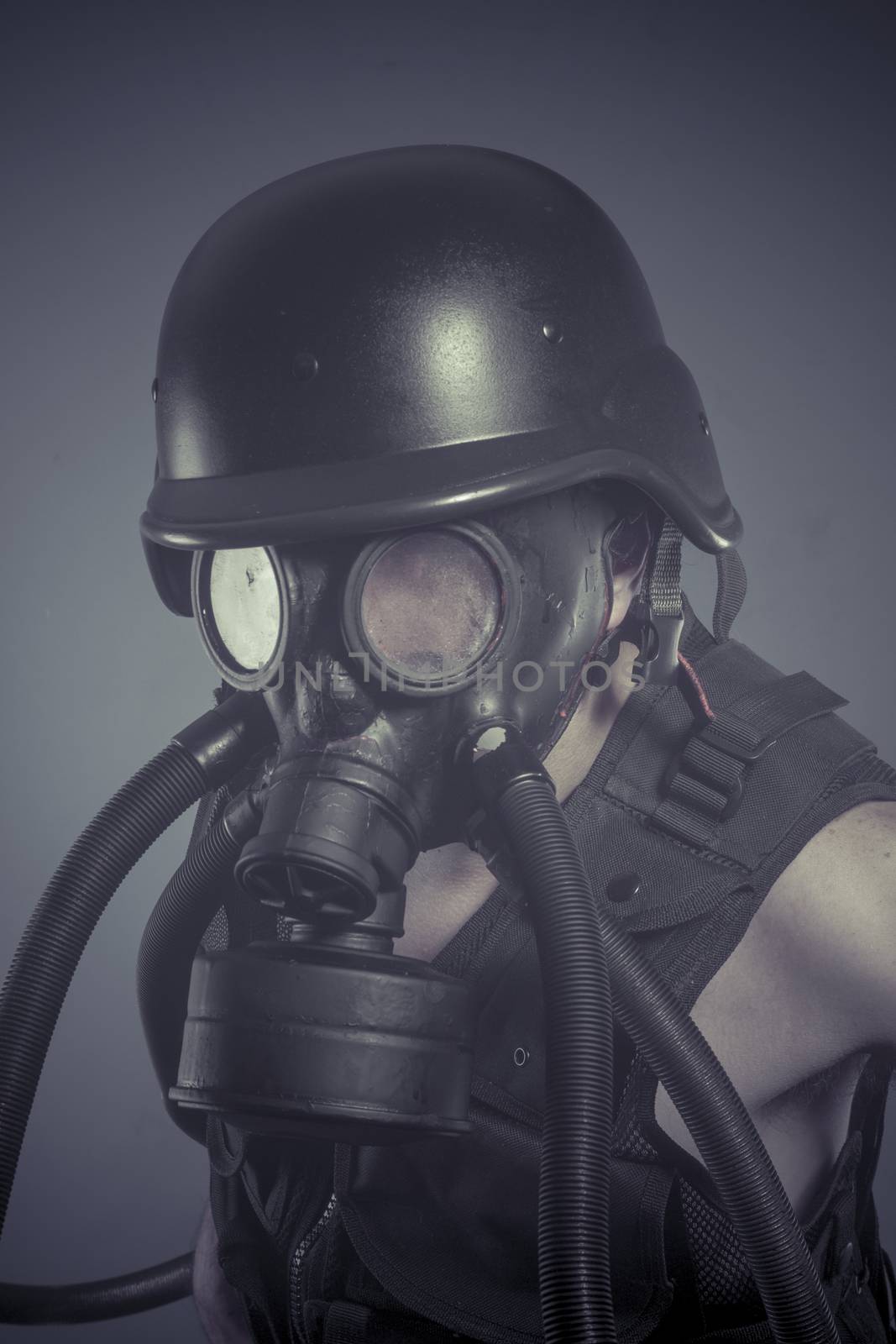 Inhalation, Man with black gas mask, pollution concept and ecological disaster