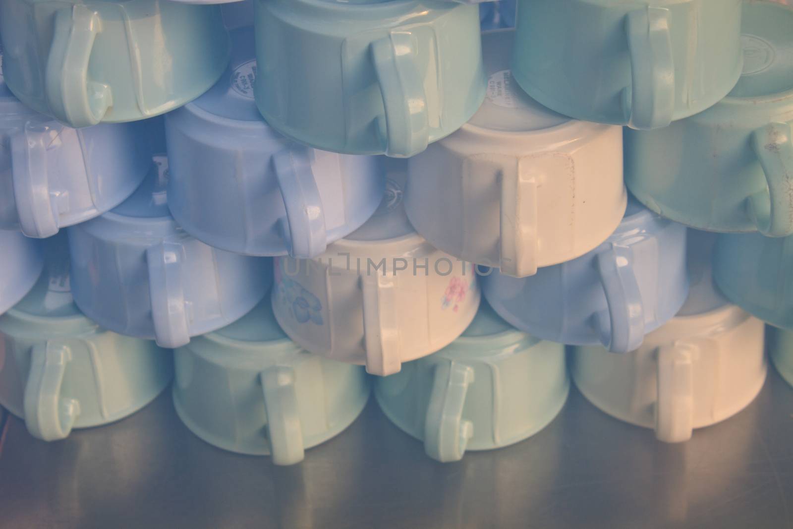 Group of coffee cups, cups for tea piled on table