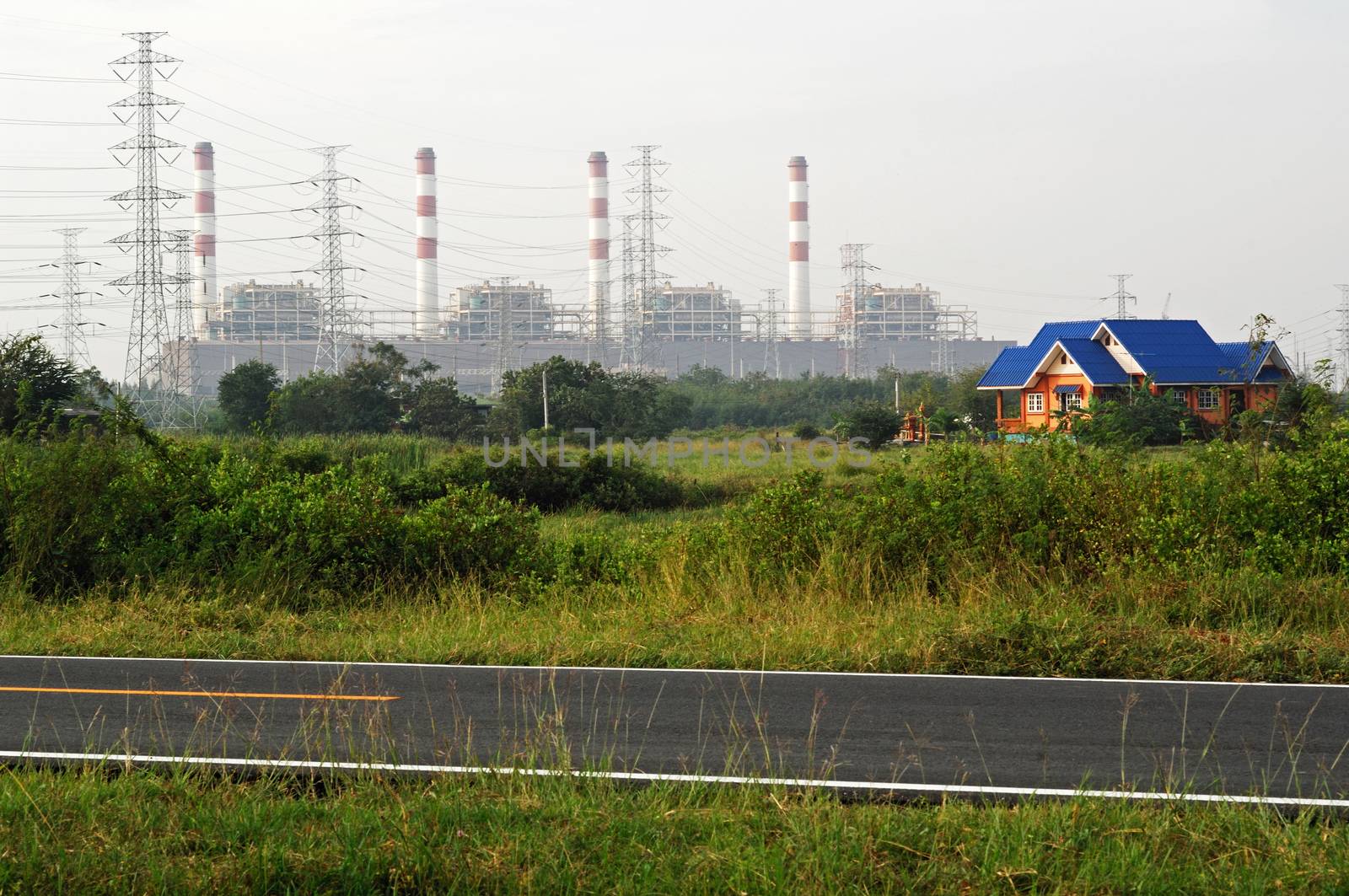 House and electricity towers