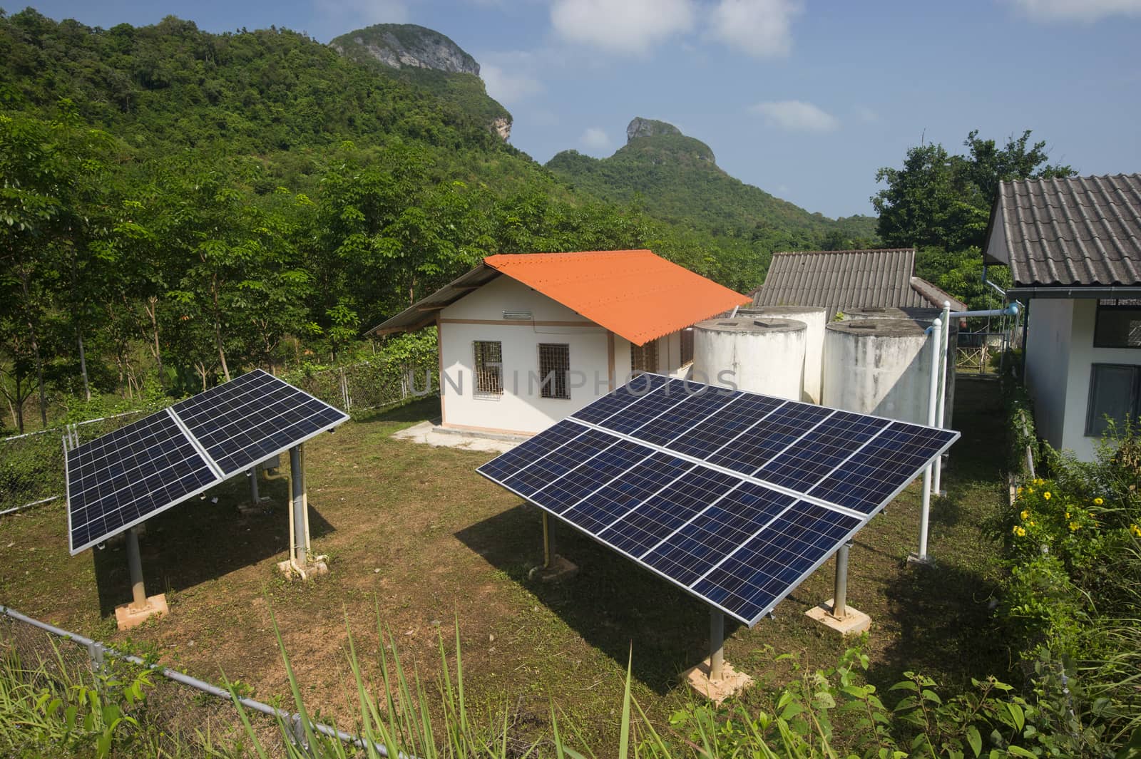 solar panel providing power to a rural area in thailand by think4photop