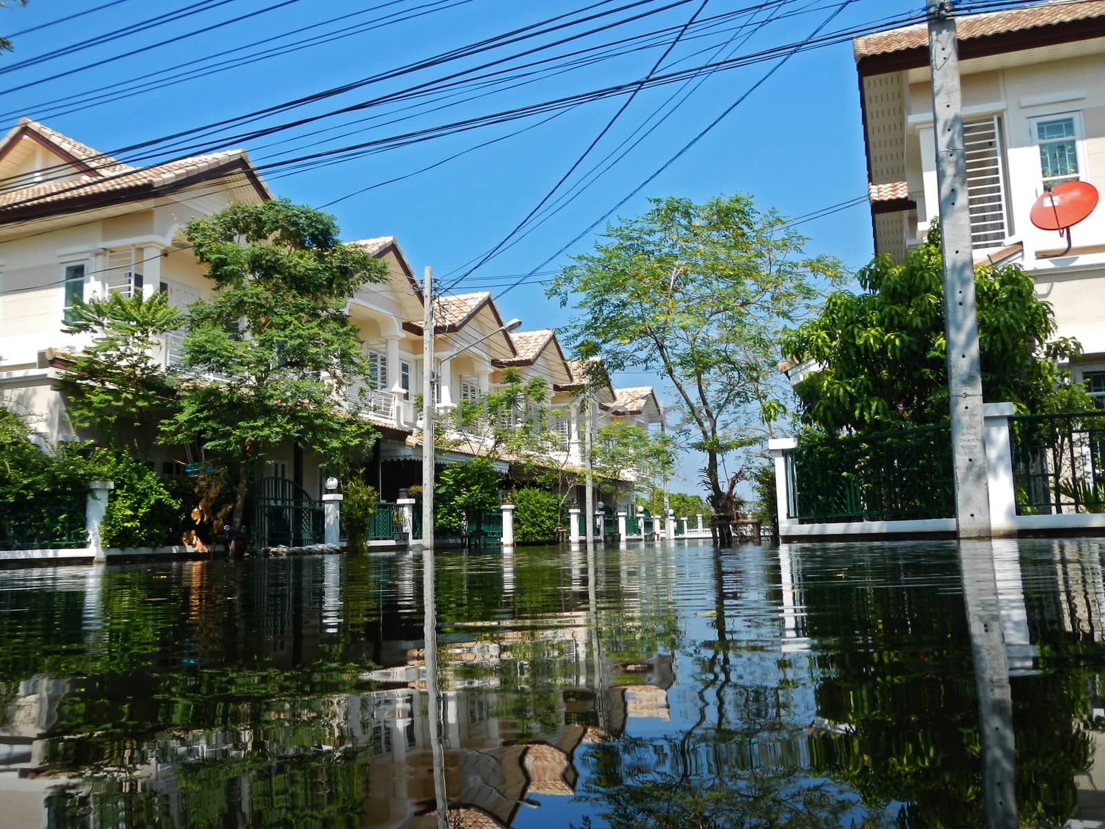 flood waters overtake a house in Thailand