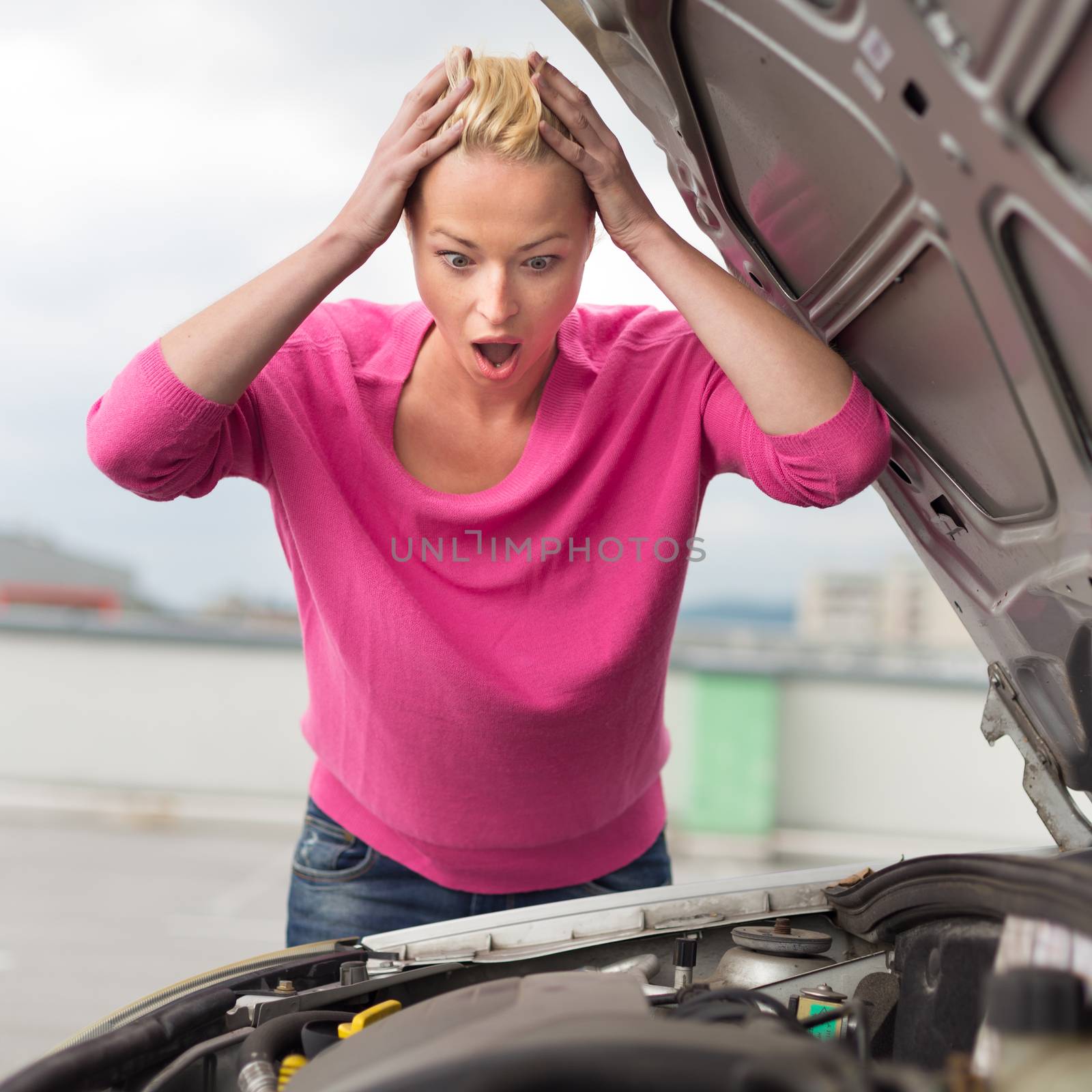 Stressed Young Woman with Car Defect. Engine breakdown.