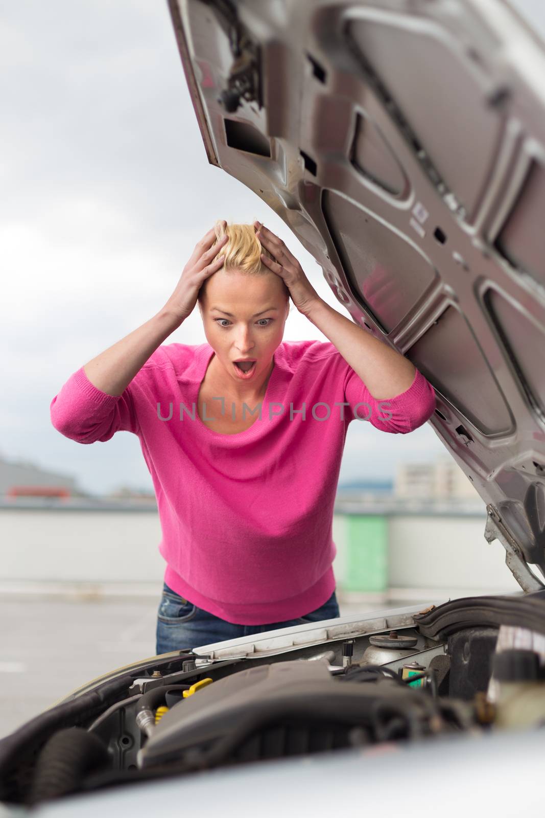 Stressed Young Woman with Car Defect. Engine breakdown.
