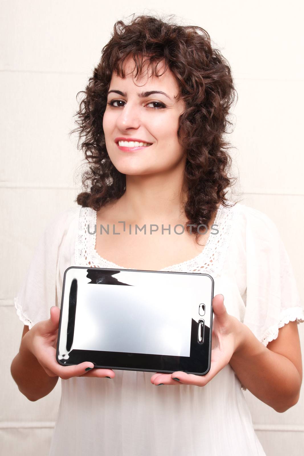A young woman holding a Tablet PC.