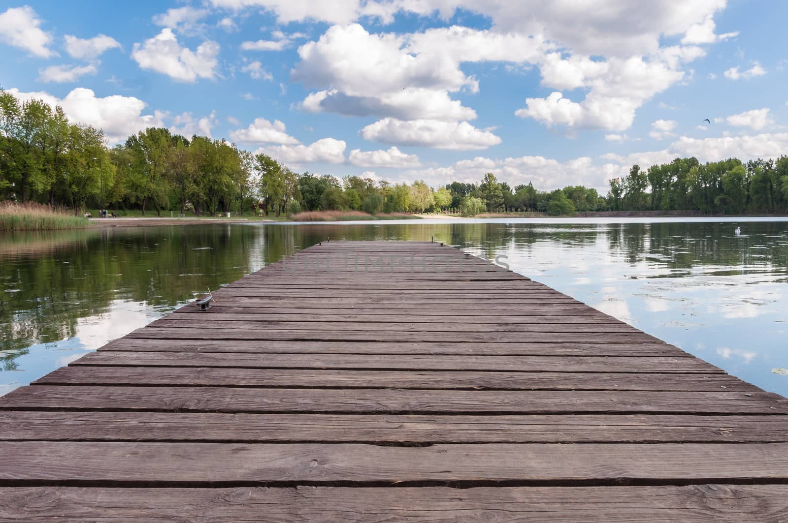 Old wooden jetty at a lake by mkos83