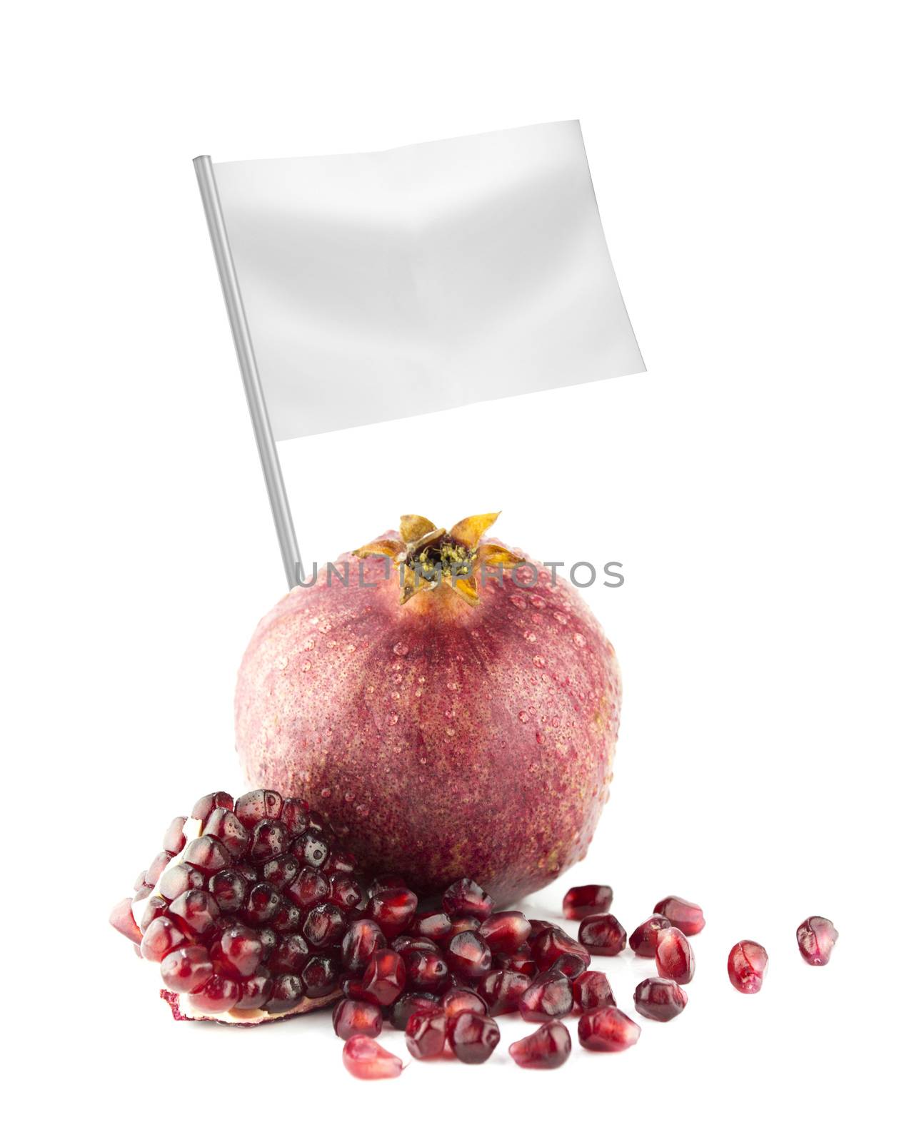 Healthy and organic food concept. Fresh Ripe pomegranate fruit and part with flag showing the benefits or the price of fruits.