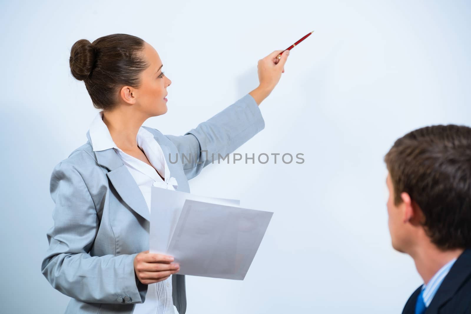 image of a Business woman showing a presentation to colleagues