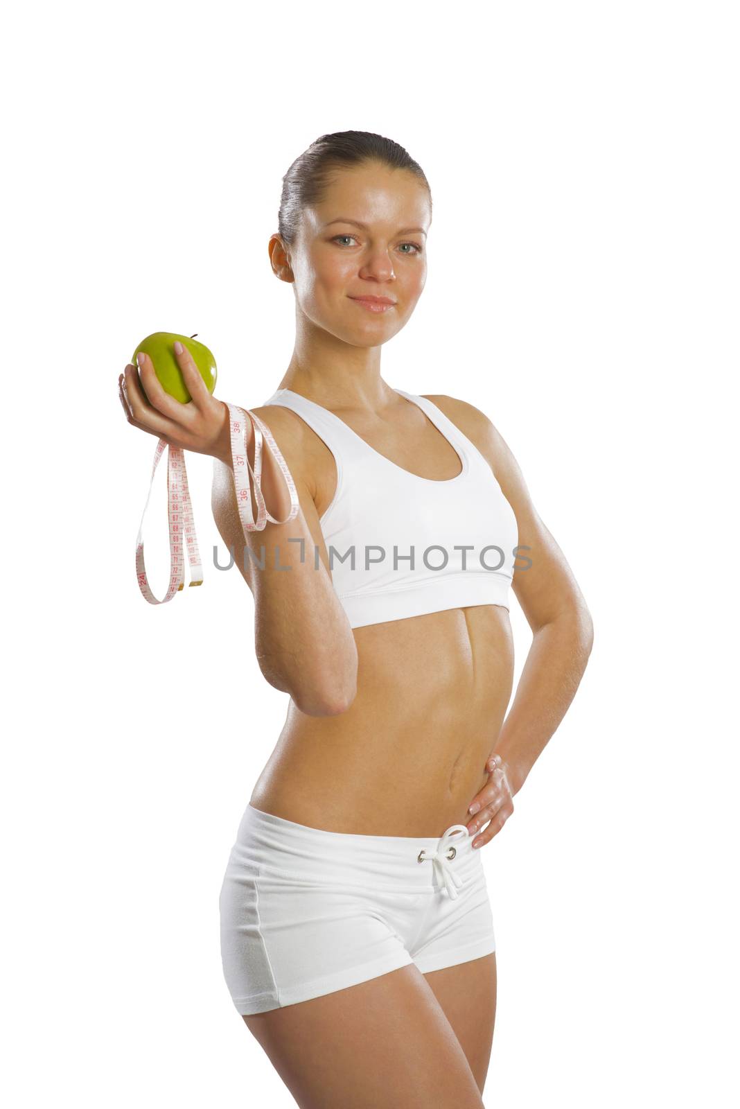 image of a young attractive woman with measuring tape and green apple