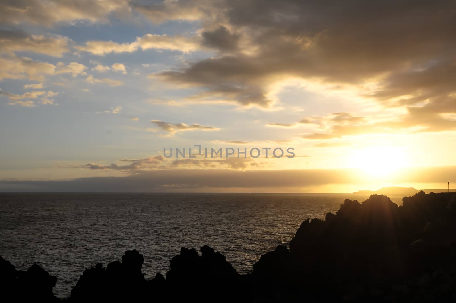 Colored Sunset Clouds Over the Atlantic Ocean in Tenerife South Spain