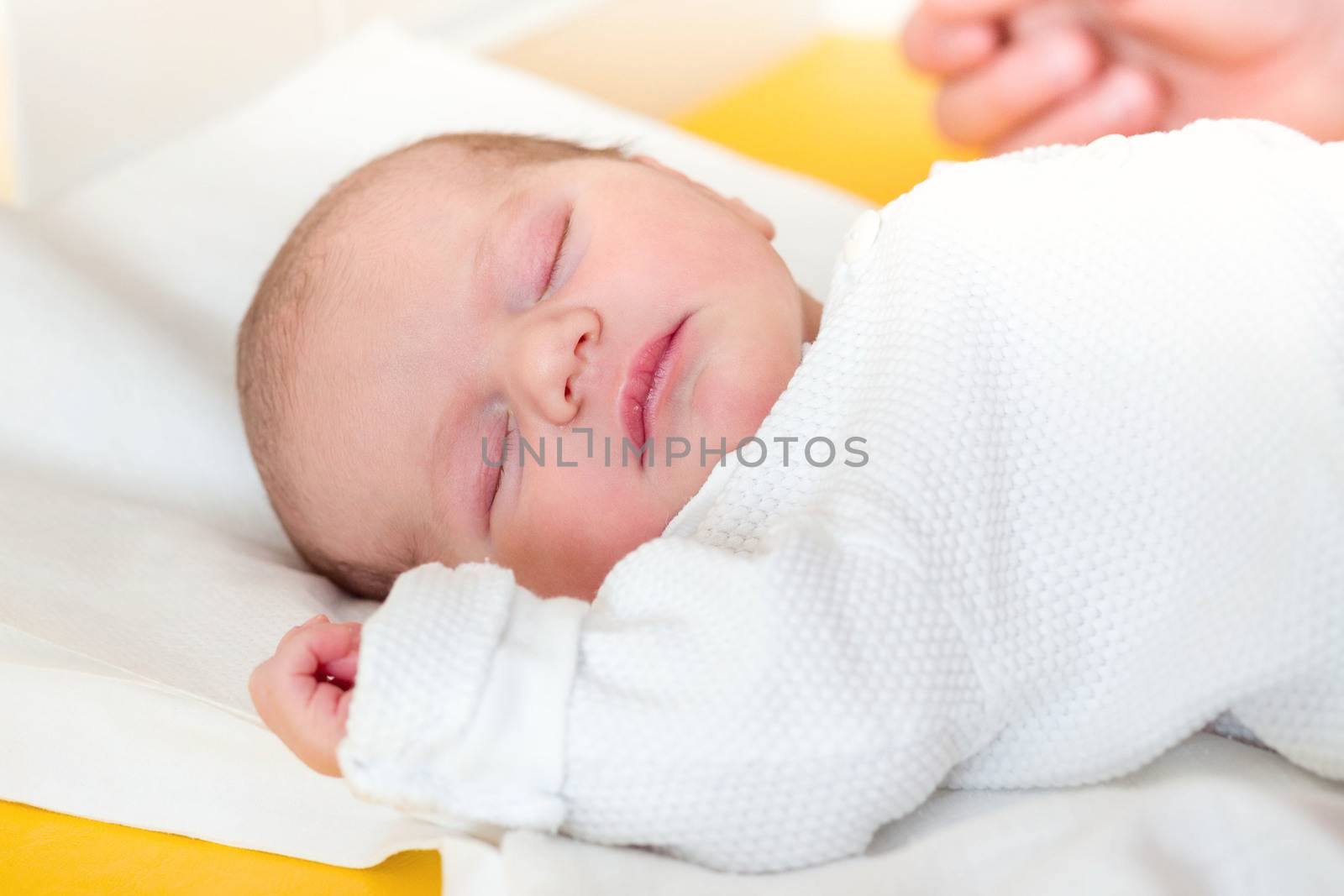 sleeping newborn baby in the hospital - the first hours of the new life